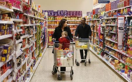 Customers shop at a Tesco shop in Bishop's Stortford, southern England November 26, 2012. REUTERS/Suzanne Plunkett