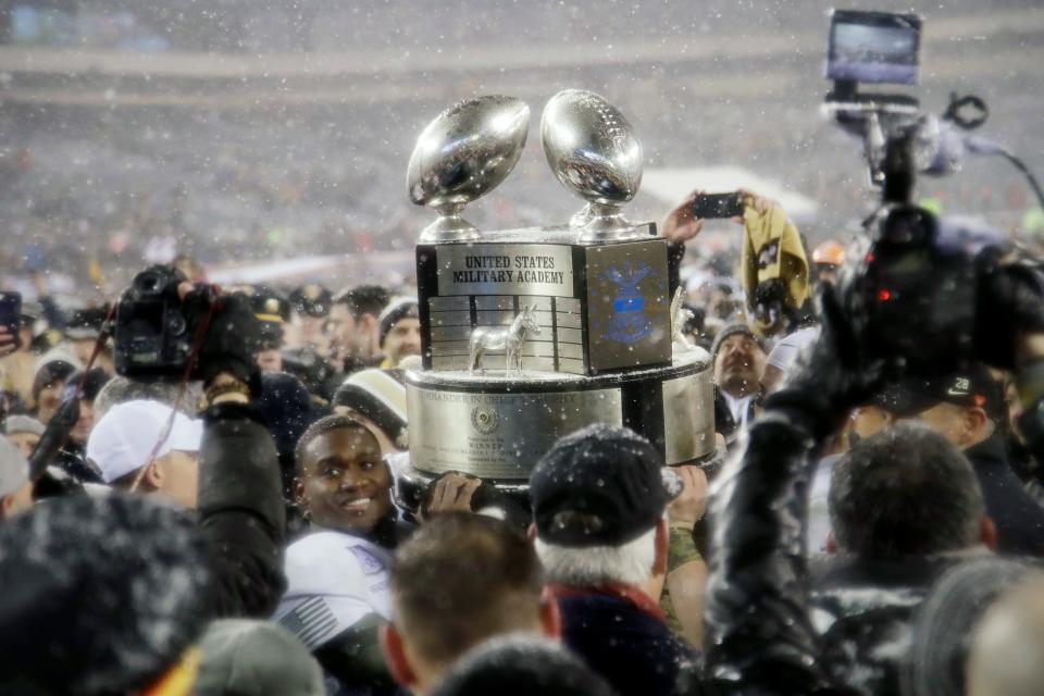FILE - This Dec. 9, 2017, file photo shows Army's Ahmad Bradshaw holding up the Commander-in-Chief's Trophy after Army defeated Navy in an NCAA college football game in Philadelphia. Army coach Jeff Monken is focused on one thing _ capturing the Commander-in-Chief's Trophy. The Black Knights can take the first step toward winning the coveted hardware, emblematic of supremacy among the three service academies, when Air Force visits Michie Stadium on Saturday, Nov. 7, 2020. (AP Photo/Matt Rourke, File)