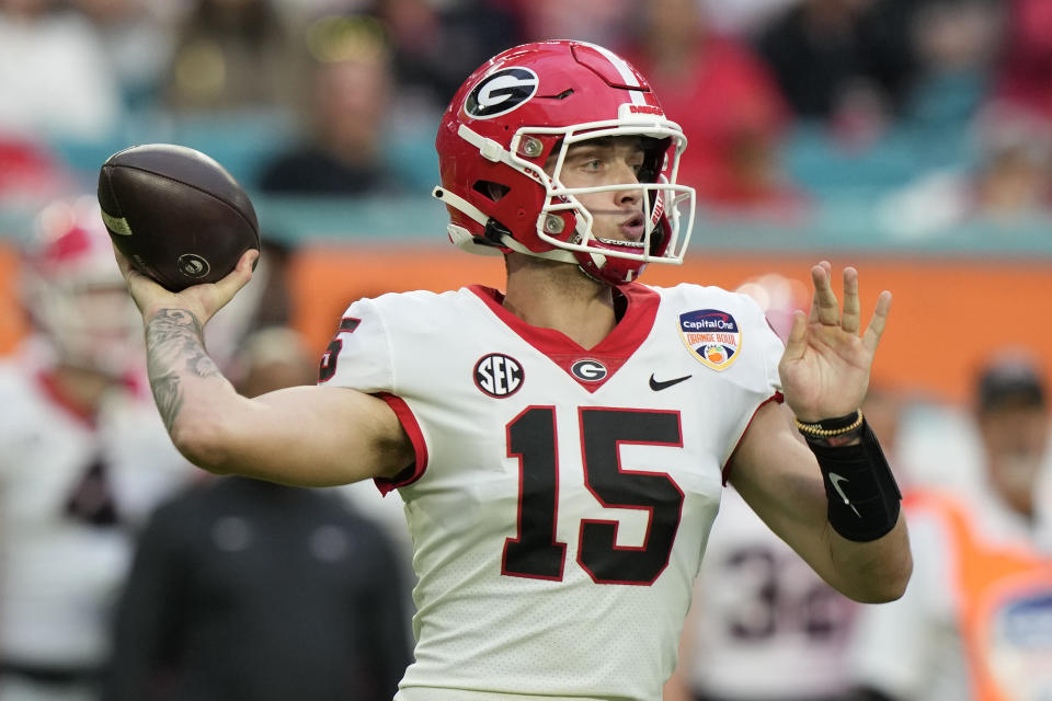 Georgia quarterback Carson Beck (15) stands back to pass during the first half of Orange Bowl NCAA college football game against Florida State, Saturday, Dec. 30, 2023, in Miami Gardens, Fla. (AP Photo/Lynne Sladky)