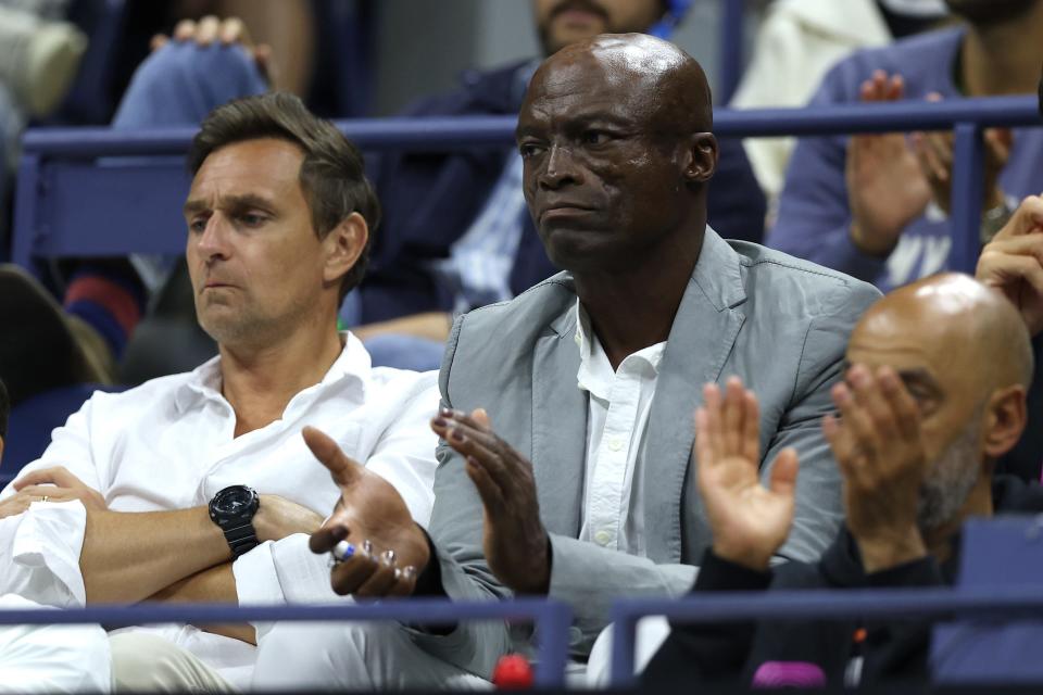 NEW YORK, NEW YORK - SEPTEMBER 02: (C) Singer-songwriter Seal reacts during the Men's Singles Fourth Round match between Jannik Sinner of Italy and Tommy Paul of the United States on Day Eight of the 2024 US Open at USTA Billie Jean King National Tennis Center on September 02, 2024 in the Flushing neighborhood of the Queens borough of New York City. (Photo by Jamie Squire/Getty Images) ORG XMIT: 776152833 ORIG FILE ID: 2169962822