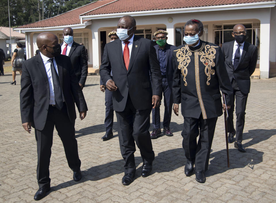 Kwazulu Natal Premier Sihle Zikalala, left, South African President Cyril Ramaphosa, centre, and Prince Mangosuthu Buthelezi arrive for the memorial service for Zulu King Goodwill Zwelithini in Nongoma, South Africa, Thursday, March 18, 2021. The monarch passed away early Friday after a reign that spanned more than 50 years. (AP Photo/Phill Magakoe)