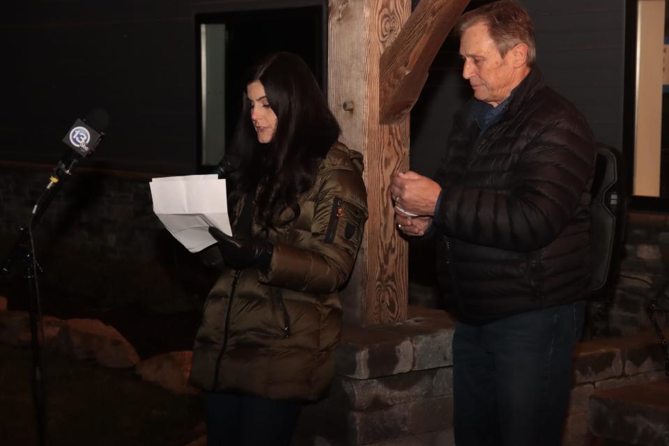 Family friend Jacki Harris, left, speaks during a vigil for missing Dee Warner on Saturday hosted by Warner's brother Gregg Hardy, right, at his farm in Tipton.