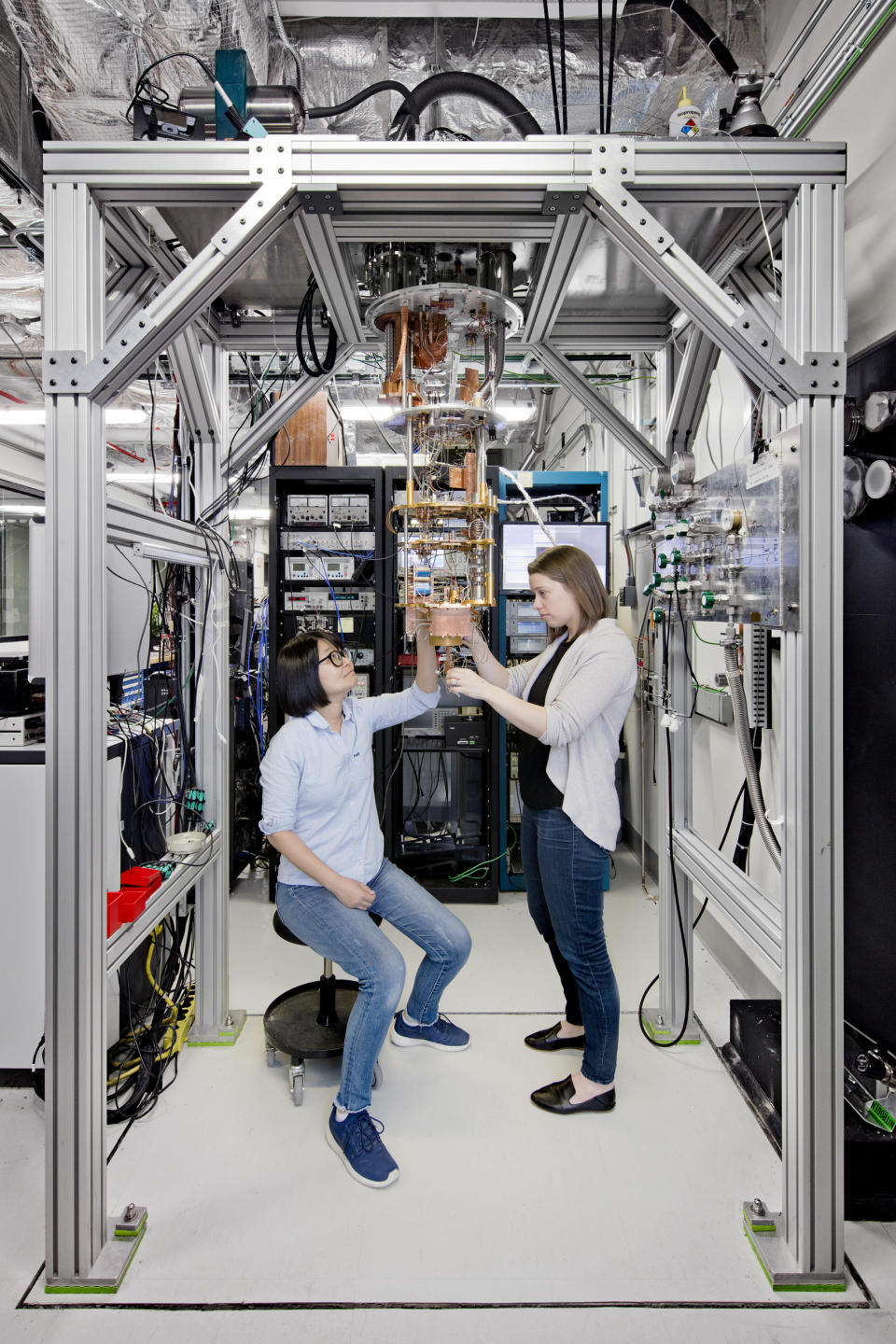 IBM scientists examine quantum computing hardware.