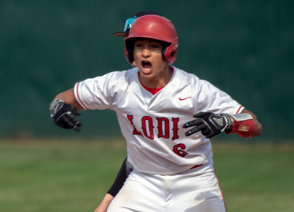 Lodi's Gavin Mora celebrates hitting a double during a varsity baseball game against Mountain House at Tony Zupo Field in Lodi on Tuesday, May, 9, 2023. Lodi won 6-4.