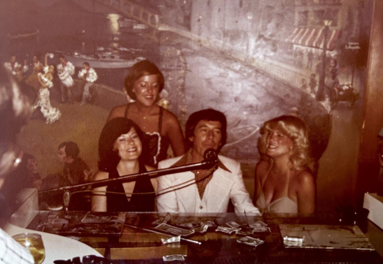 Pianist Gene Nordan, seen in this picture from the 1970s, was a popular fixture at Le Chateau restaurant's piano bar in Atlantic Beach. Here he is with some fans. Visitors often joined him at the piano and sang along. Note the bills on the top of the piano; he was tipped generously by patrons when he played their favorite songs. That's a painting of Venice, Italy, on the wall behind him.