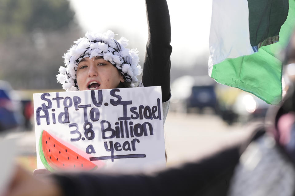 Amana Ali joins about three dozen people protesting Israel's attacks in Gaza, Thursday, Feb. 8, 2024 in Dearborn, Mich. The protesters gathered hoping to be heard by members of the Biden White House who were scheduled to meet in suburban Detroit with Muslim and Arab American leaders. (AP Photo/Carlos Osorio)