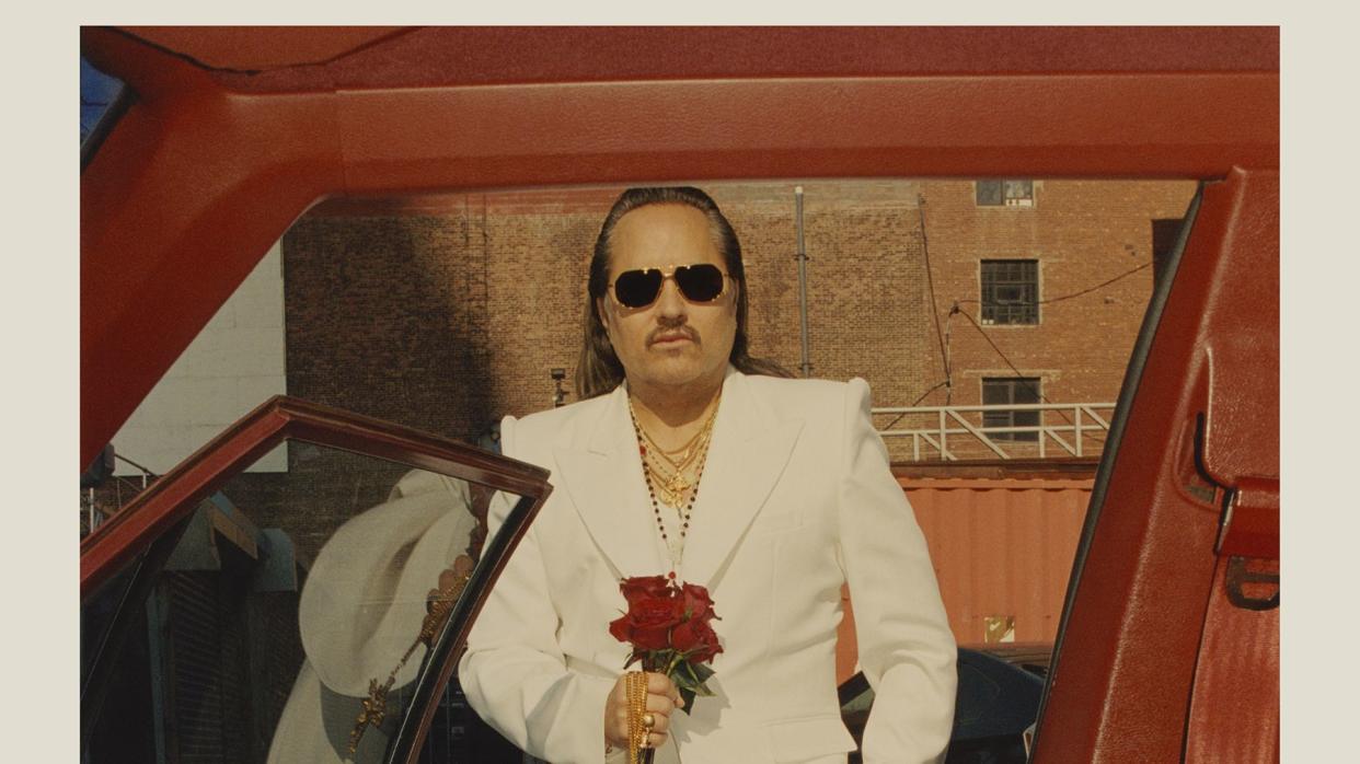 willy chavarria in a white suit