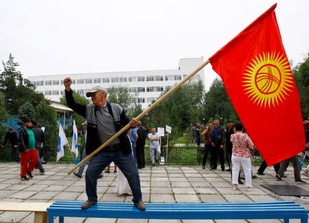 FILE PHOTO: A supporter of Kyrgyz former President Almazbek Atambayev attends a rally in Bishkek, Kyrgyzstan