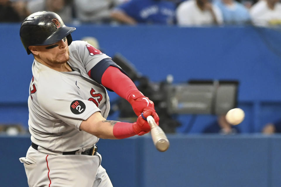 Boston Red Sox catcher Christian Vazquez hits a single off Toronto Blue Jays starting pitcher Ross Stripling during the fifth inning of a baseball game in Toronto on Tuesday, June 28, 2022. (Jon Blacker/The Canadian Press via AP)