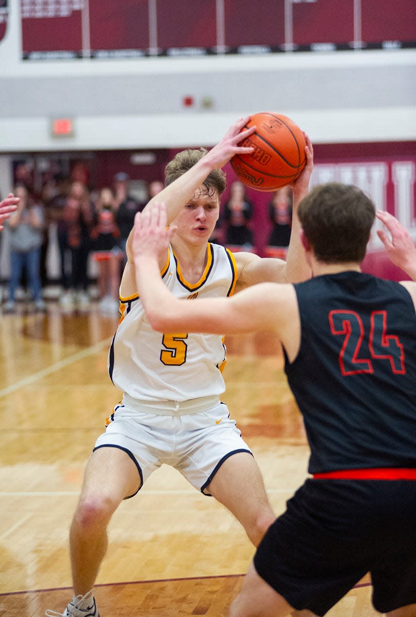 Colonel Crawford's Trevor Vogt looks to get around Seneca East's Lucas Hicks.