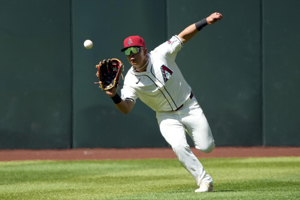 Arizona Diamondbacks center fielder Jorge Barrosa makes the running catch on a ball hit by New York Yankees' Anthony Volpe in the sixth inning during a baseball game, Wednesday, April 3, 2024, in Phoenix. (AP Photo/Rick Scuteri)