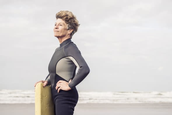 Portrait of mature female bodyboarder, Devon, UK