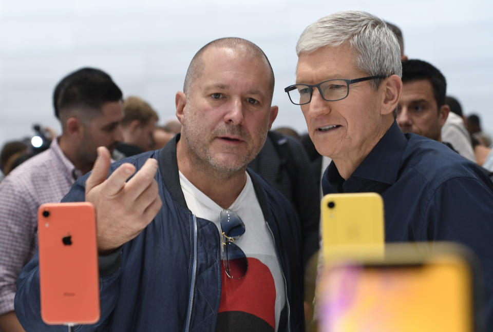 CUPERTINO, CALIFORNIA - SEPTEMBER 12: Apple chief design officer Jony Ive (L) and Apple CEO Tim Cook inspect the new iPhone XR at the Steve Jobs Theater on September 12, 2018 in Cupertino, California. Apple released three new versions of the iPhone and an updated Apple Watch in Cupertino on Wednesday. (Photo by Qi Heng/VCG via Getty Images)