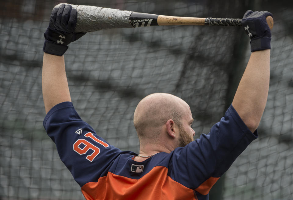 Houston Astros' Brian McCann stretches before batting practice during a workout in Cleveland, Sunday, Oct. 7, 2018. The Astros are to play the Cleveland Indians in the third game of their ALDS series, Monday. (AP Photo/Phil Long)