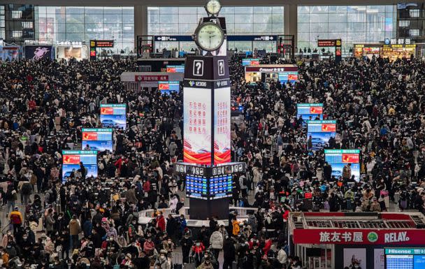 PHOTO: Travellers crowd at the gates and wait for trains at the Shanghai Hongqiao Railway Station during the peak travel rush for the upcoming Chinese New Year holiday on Jan. 15, 2023 in Shanghai, China. (Kevin Frayer/Getty Images)
