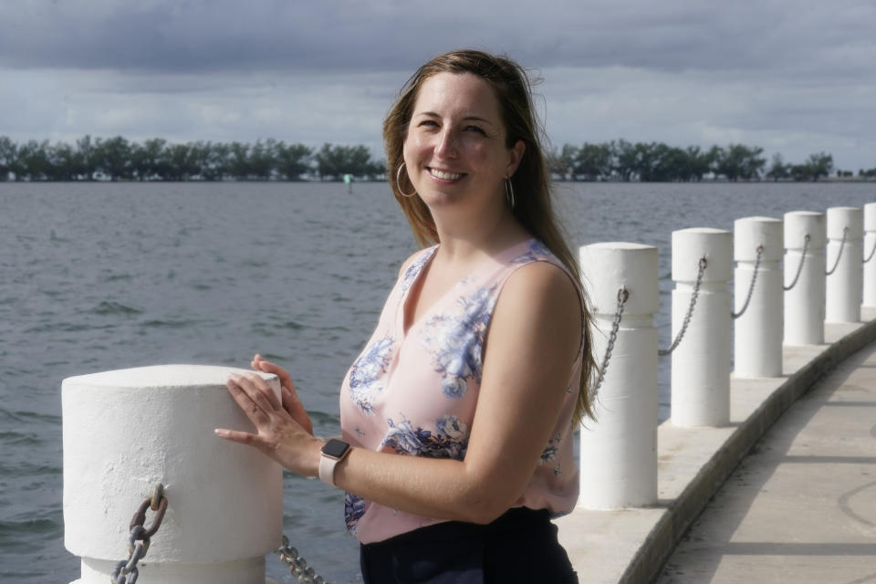 Sonia Brubaker, Miami Dade County Resiliency Officer, stands on a seawall, Monday, Sept. 26, 2022, in Miami. States are spending billions of dollars of federal pandemic relief funds on infrastructure projects such as roads, bridges and public buildings. The American Rescue Plan law signed by President Joe Biden last year provided $350 billion to states and local governments to respond to the coronavirus and shore up their economies. (AP Photo/Marta Lavandier)