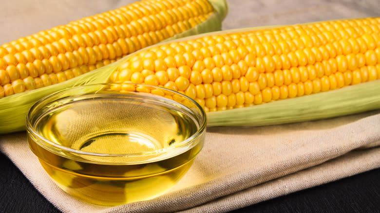 bowl of oil and ears of corn