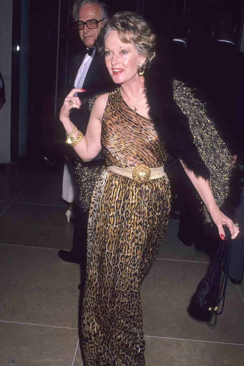 <p>The animal lover has long had a penchant for jungle-themed prints: here, she wears a leopard-print gown and a belt featuring a gold lion head at the 1990 American Cinema Awards in Beverly Hills. </p>