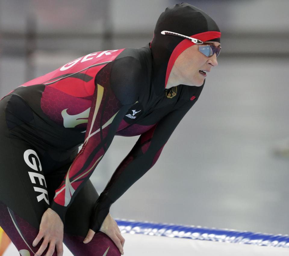 Claudia Pechstein of Germany catches her breath after competing in the women's 3,000-meter speedskating race at the Adler Arena Skating Center during the 2014 Winter Olympics, Sunday, Feb. 9, 2014, in Sochi, Russia. (AP Photo/Matt Dunham)