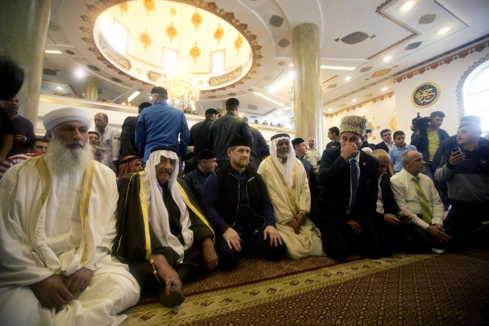 Chechen President Ramzan Kadyrov, center, prays inside a new mosque in the Arab village of Abu Ghosh, on the outskirts of Jerusalem, Sunday, March 23, 2014. Isa Jabar, the mayor of the village, says Chechnya donated $6 million for the new mosque and that some Abu Ghosh residents trace their ancestry to 16th century Chechnya and the Caucus region. (AP Photo/Sebastian Scheiner)