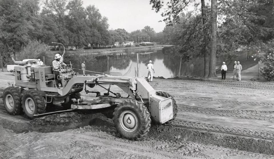 A grader helps fill in a portion of Southside Park’s lake  in 1965 as part of the W-X freeway project, which extended W Street through the Sacramento park. The state lopped off about 7 acres of the park to build Highway 50.