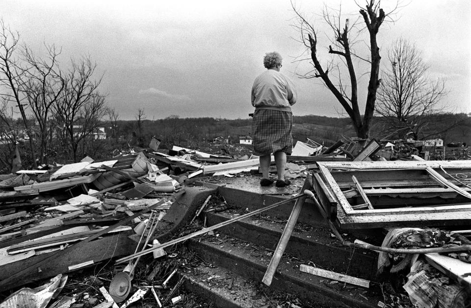 Mary Feldkamp stands on what was left of her home in Dent, Ohio, after the Super Outbreak of tornadoes struck the region on April 3, 1974.