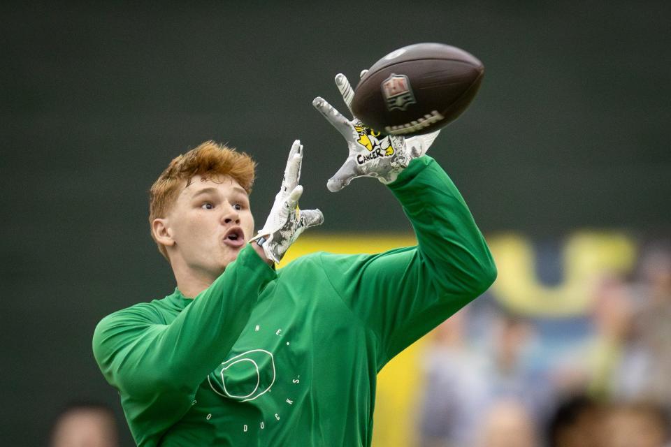 Oregon tight end Terrance Ferguson catches a pass from former Oregon quarterback Bo Nix during Oregon Pro Day March 12 at the Moshofsky Center in Eugene.