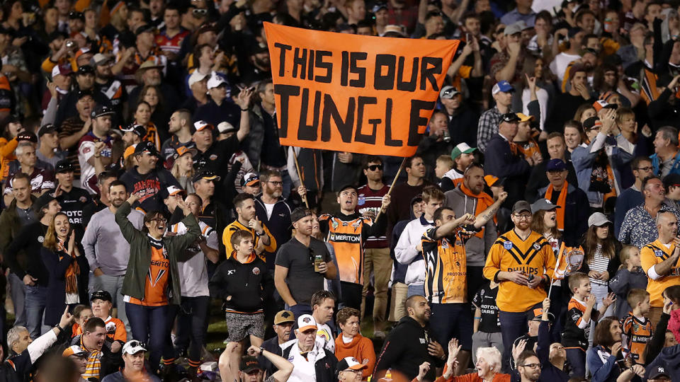 Pictured here, Wests Tigers fans cheer on a match at Leichhardt Oval.