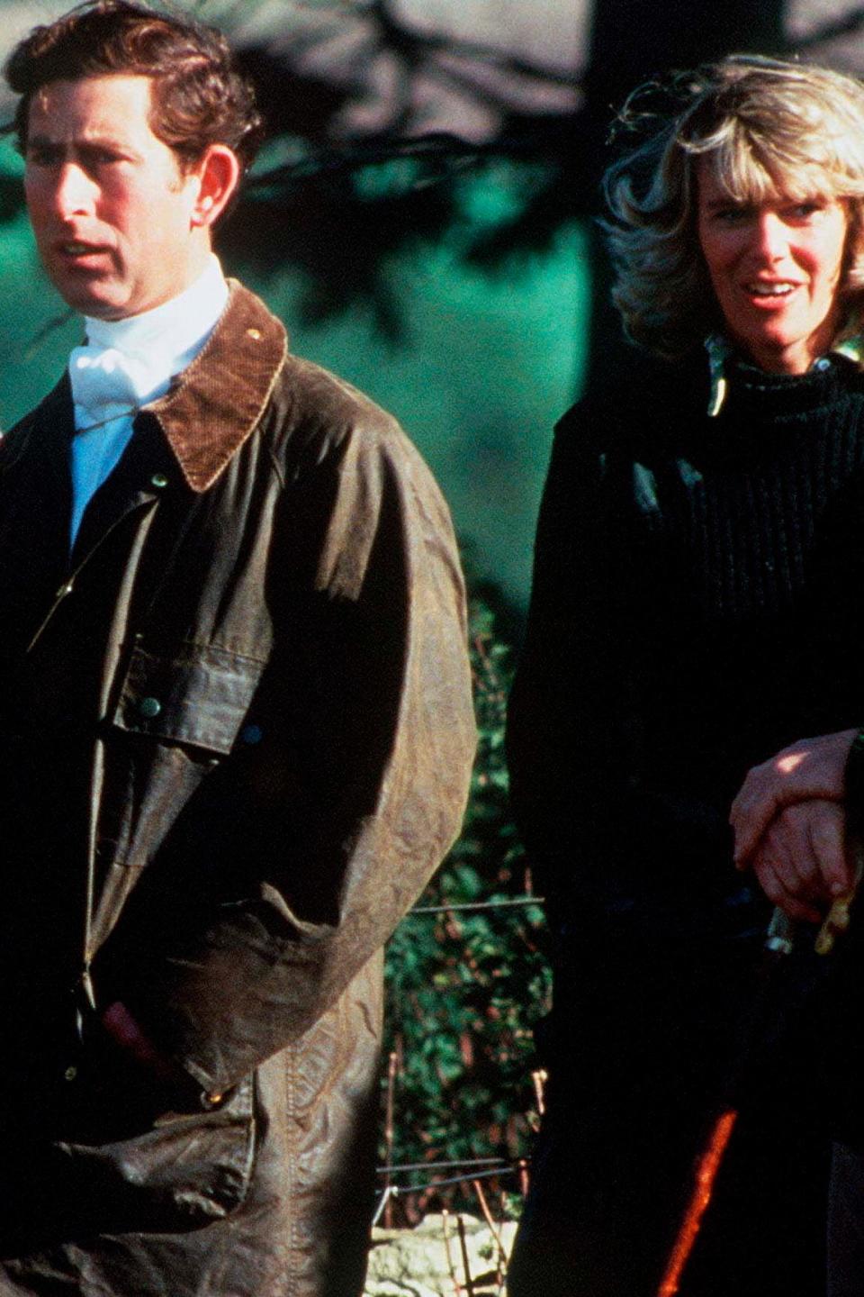 Prince Charles and Camilla Parker Bowles walking together outside