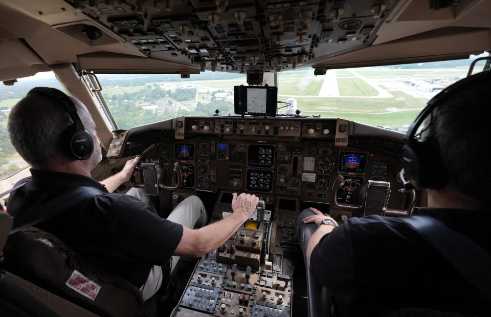 Honeywell test pilot Joe Duval, left, pulls a Boeing 757 test aircraft out of a landing approach demonstrating runway hazard warning systems over the airport in Tyler, Texas, Tuesday, June 4, 2024. (AP Photo/LM Otero)