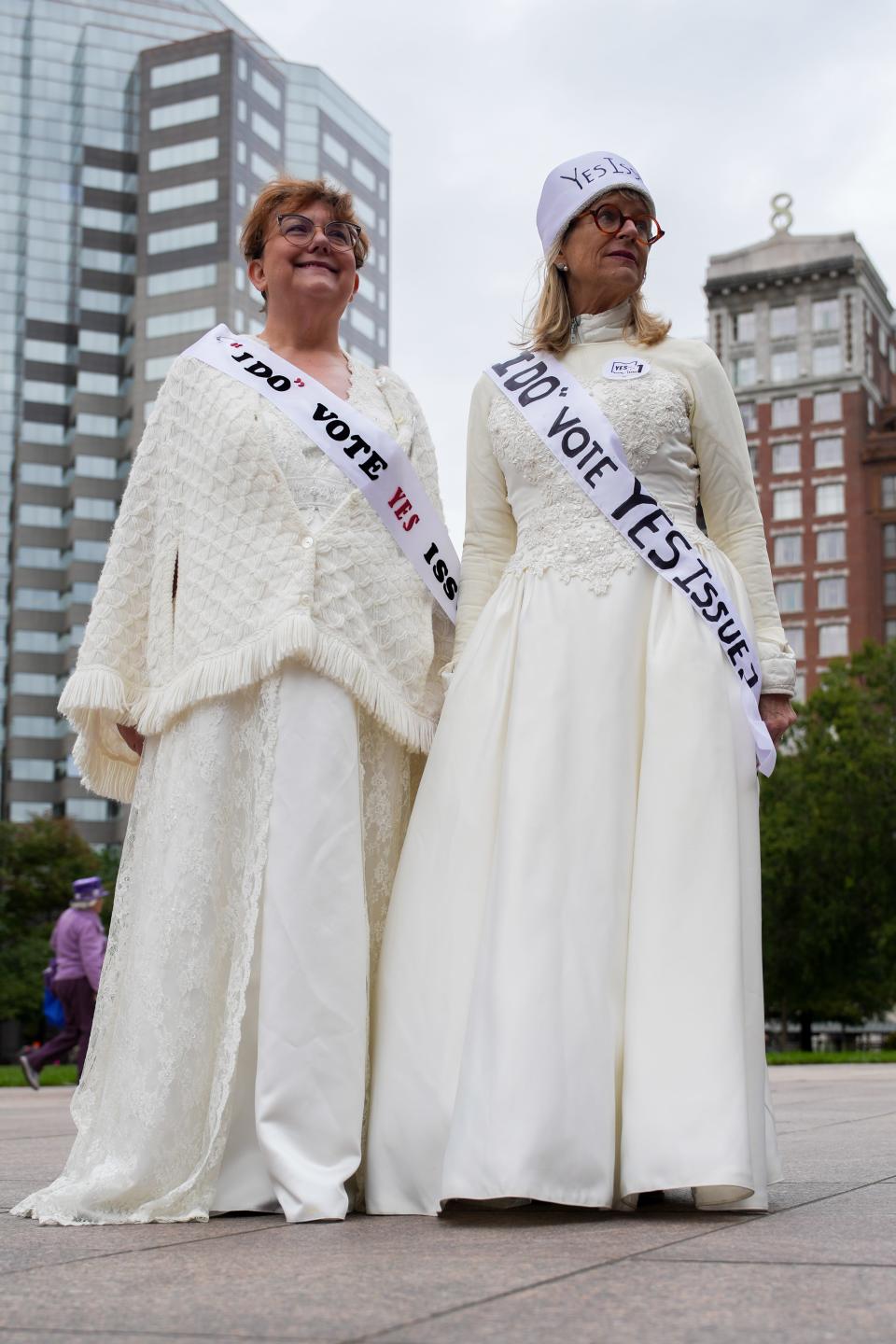 Mary Kestner and Carolyn Harding wear their wedding dresses to support abortion rights at the Sunday rally in support of Issue 1 in Ohio.