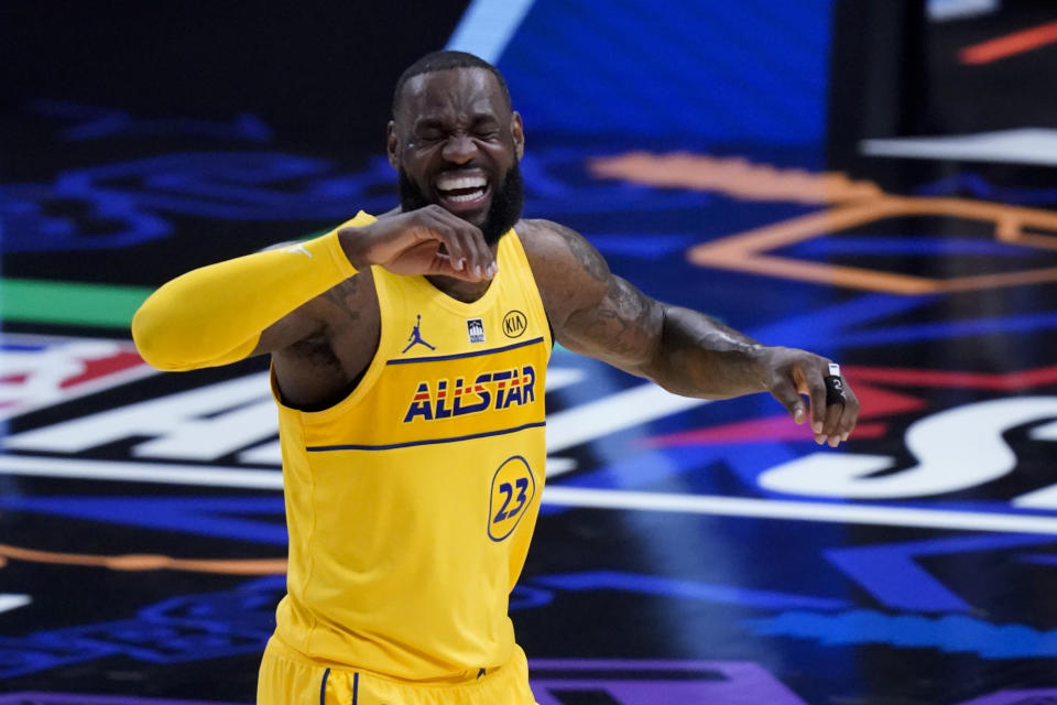 Los Angeles Lakers forward LeBron James smiles during the first half of basketball's NBA All-Star Game in Atlanta, Sunday, March 7, 2021. (AP Photo/Brynn Anderson)