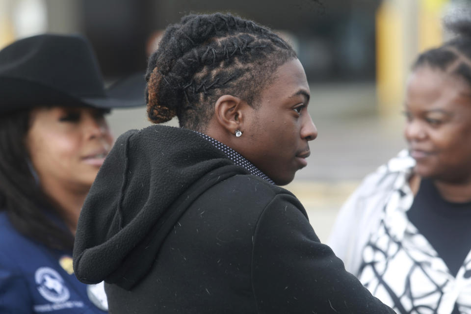 FILE - Darryl George, an 18-year-old high school junior, stands outside a courthouse in Anahuac, Texas, on Wednesday, Jan. 24, 2024, following a court hearing over whether his Houston-area school district can continue to punish him for refusing to change his hairstyle. For as long as schools have policed hairstyles as part of their dress codes, some students have seen the rules as attempts to deny their cultural and religious identities. To school administrators, strict dress codes can be tools for promoting uniformity and discipline. (AP Photo/Lekan Oyekanmi, File)