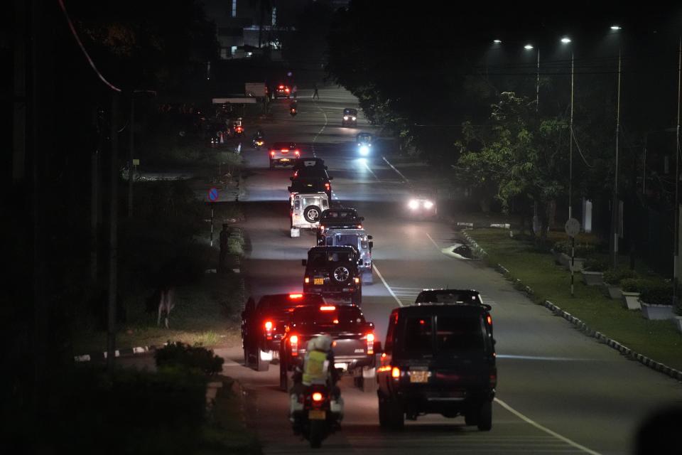 A motorcade which is believed to be conveying Sri Lanka's former president Gotabaya Rajapaksa leaves the Bandaranaike International airport in Colombo, Sri Lanka, Saturday, Sept. 3, 2022. Gotabaya Rajapaksa, who fled the country in July after tens of thousands of protesters stormed his home and office in a display of anger over the country's economic crisis, has returned to the country after seven weeks. (AP Photo/Eranga Jayawardena)