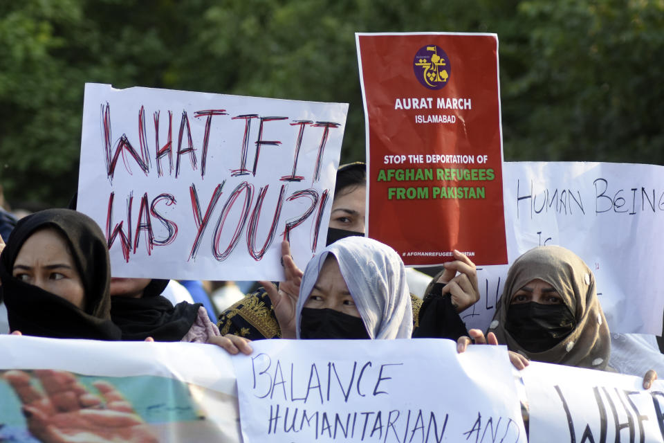 A social group, Aurat March, hold signs during a demonstration against Pakistani government, in Islamabad, Pakistan, Sunday, Oct. 29, 2023. Pakistan says it has recently announced plans to deport all migrants who are in the country illegally, including 1.7 million Afghans, who will be implemented in a "phased and orderly manner." (AP Photo/W.K. Yousafzai)