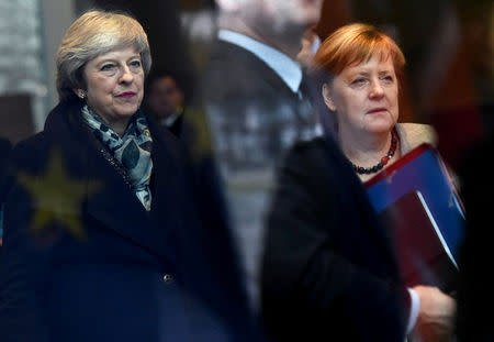 British Prime Minister Theresa May and German Chancellor Angela Merkel arrive at the chancellery in Berlin, Germany December 11, 2018. REUTERS/Annegret Hilse