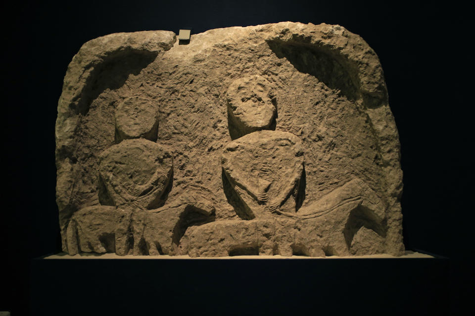 An equestrian nomad's gravestone from the first-second century A.D., is displayed as part of the exhibit called The Crimea - Gold and Secrets of the Black Sea, at Allard Pierson historical museum in Amsterdam Friday April 4, 2014. The museum has gotten more than the bronze swords, golden helmets and precious gems it bargained for as it is unsure where to return the collection after Russia annexed Crimea. (AP Photo/Peter Dejong)