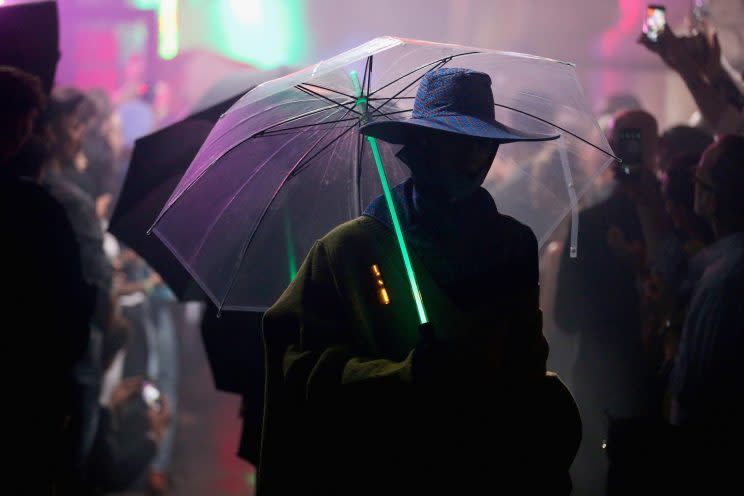 A closeup of the <em>Blade Runner-</em>inspired light saber umbrellas from the Raf Simons SS18 show. (Photo: Getty)