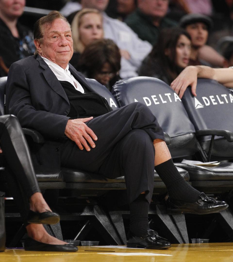 FILE - In this Dec. 19, 2010, file photo, Los Angeles Clippers owner Donald Sterling looks on during the second half of an NBA preseason basketball game between the Clippers and the Los Angeles Lakers in Los Angeles. The NBA is investigating a report of an audio recording in which a man purported to be Sterling makes racist remarks while speaking to his girlfriend. NBA spokesman Mike Bass said in a statement Saturday, APril 26, 2014, that the league is in the process of authenticating the validity of the recording posted on TMZ's website. Bass called the comments "disturbing and offensive." (AP Photo/Danny Moloshok, File)