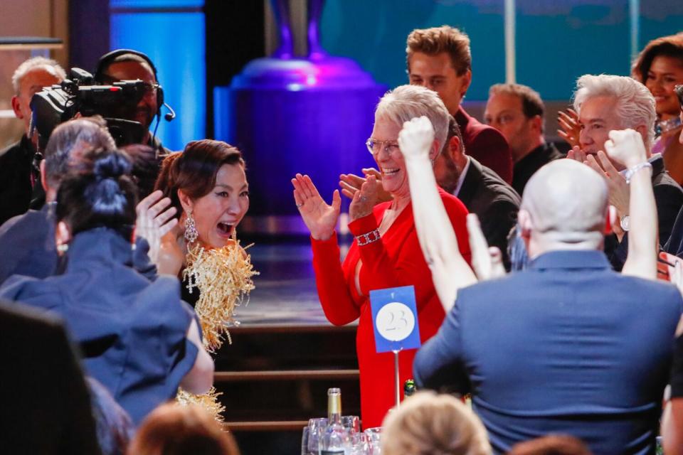 Michelle Yeoh celebrates winning female actor in a leading role at the Screen Actors Guild Awards.