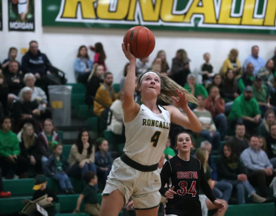 Aberdeen Roncalli's Morgan Fiedler (4) goes up for a layup in a contest against Sisseton on Jan. 28, 2022 inside the Roncalli High School.