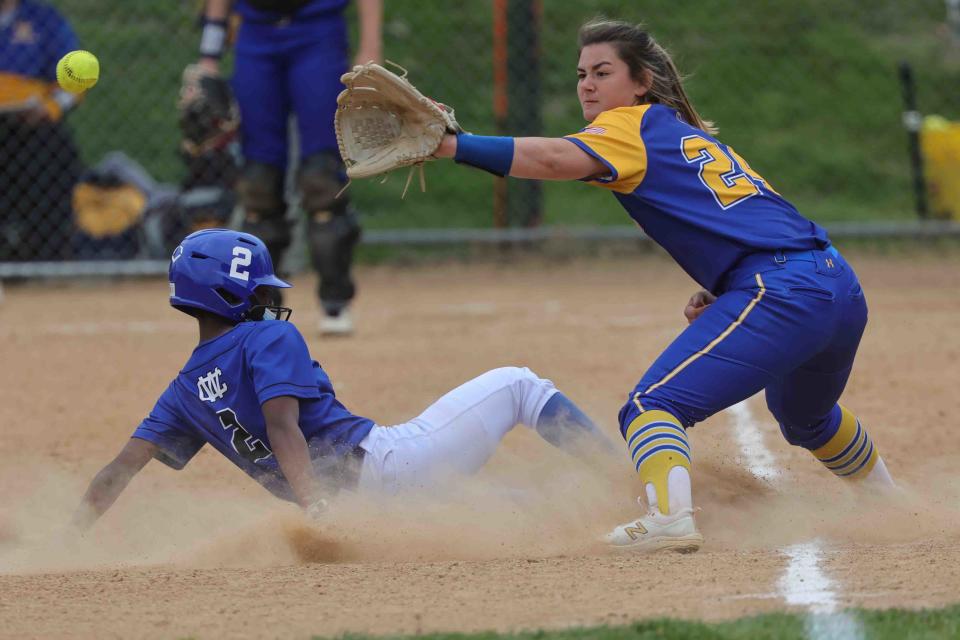 Charter of Wilmington's Jaida Church (2) slides into third base against Caesar Rodney.