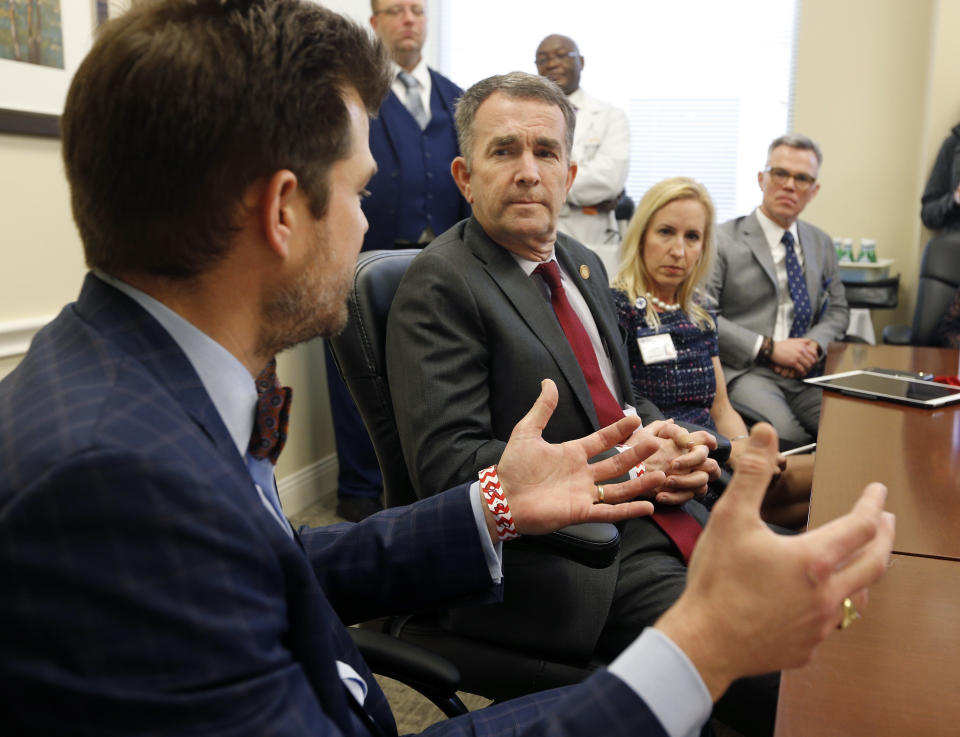 Virginia Gov. Ralph Northam meets with health care providers at Richmond Community Hospital to discuss the coronavirus, Friday March 13, 2020, in Richmond, Va. Virginia Gov. Ralph Northam on Friday ordered all schools in Virginia to close for at least two weeks as the coronavirus spreads, a move that follows similar orders in several other states. (James H. Wallace/Richmond Times-Dispatch via AP)