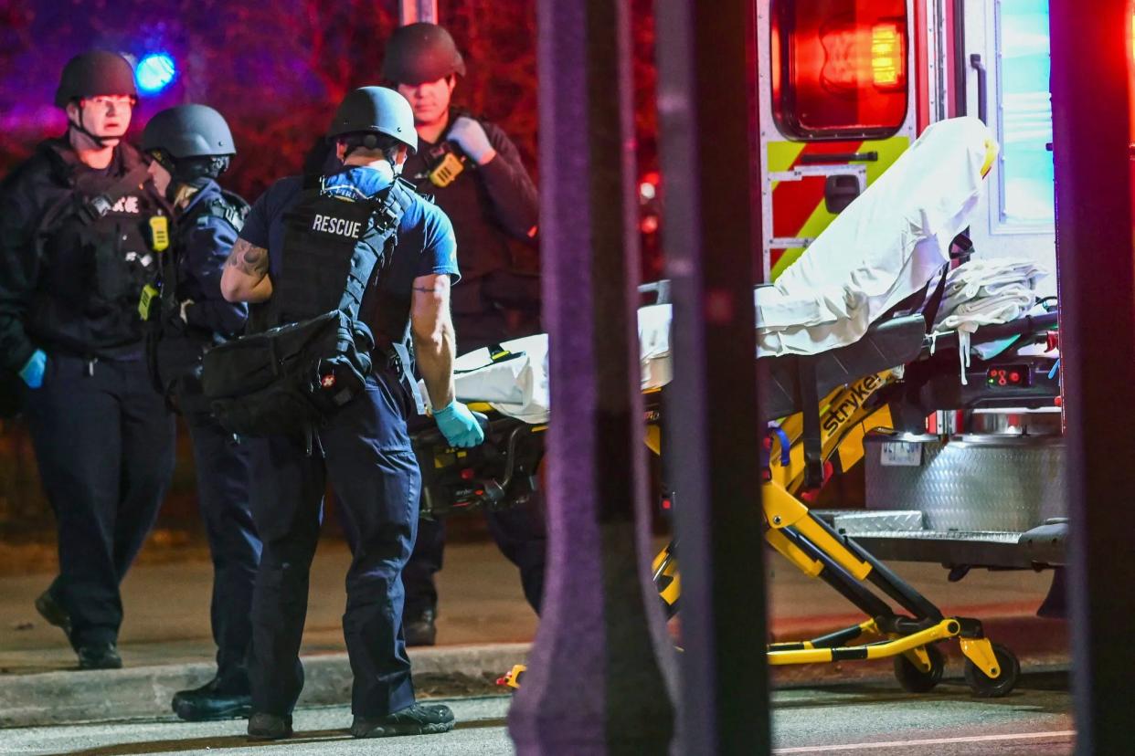 A stretcher is unloaded from an ambulance outside the Michigan State University Union following shootings on campus on Monday, 13 February 2023 (AP)