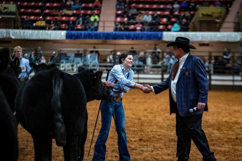 Sadie Wampler, 15, shakes hands with judge Jarold Callahan after her steer was recognized as Grand Champion during the Fort Worth Stock Show and Rodeo’s Jr. Steer Show on Friday, Feb. 3, 2023.