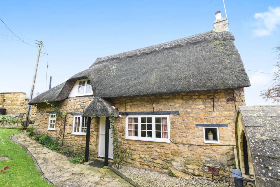 <p>With a gorgeous thatched roof, this quaint two-bedroom cottage exudes rustic Cotswold appeal. Located in the heart of Ebrington village, the property has a sitting room with an impressive inglenook <a rel="nofollow noopener" href="http://www.housebeautiful.co.uk/renovate/heating/a1084/open-fires-stoves-guide/" target="_blank" data-ylk="slk:fireplace;elm:context_link;itc:0;sec:content-canvas" class="link ">fireplace</a>, fitted kitchen with granite work surfaces and <a rel="nofollow noopener" href="http://www.housebeautiful.co.uk/garden/designs/how-to/a912/low-maintenance-garden-yearly-wow-factor/" target="_blank" data-ylk="slk:low maintenance gardens;elm:context_link;itc:0;sec:content-canvas" class="link ">low maintenance gardens</a> with a sun terrace. </p><p><em>This property is available for £395,000 through <a rel="nofollow noopener" href="http://www.rabennett.co.uk/buy/property/2-bedroom-detached-cottage-in-ebrington,gl55-ref-3926599/" target="_blank" data-ylk="slk:RA Bennett Partners;elm:context_link;itc:0;sec:content-canvas" class="link ">RA Bennett Partners</a>.</em></p>