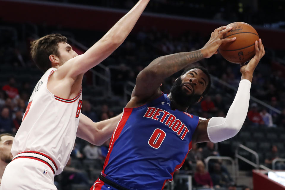 Chicago Bulls forward Luke Kornet, left, defends as Detroit Pistons center Andre Drummond (0) attempts to shoot during the first half of an NBA basketball game, Saturday, Jan. 11, 2020, in Detroit. (AP Photo/Carlos Osorio)