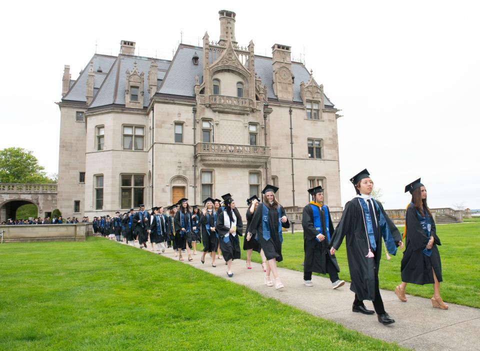 Salve Regina University graduates process past Ochre Court as they make their way on campus to the 74th Commencement in Newport. Provided by Salve Regina University/Andrea Hansen