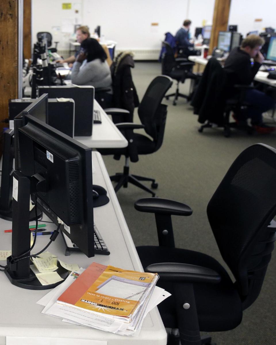 In this Dec. 31, 2013 photo, guides work the phone bank at MnSure, Minnesota's insurance marketplace in St. Paul, Minn.The 14 states running their own insurance marketplaces had their 2014 budgets footed by the federal government, but starting in 2015 were supposed to fund themselves. Most planned to do so with revenue derived from enrollments, but in states like Minnesota, the lagging pace of sign ups has thrown that into question. (AP Photo/Jim Mone)