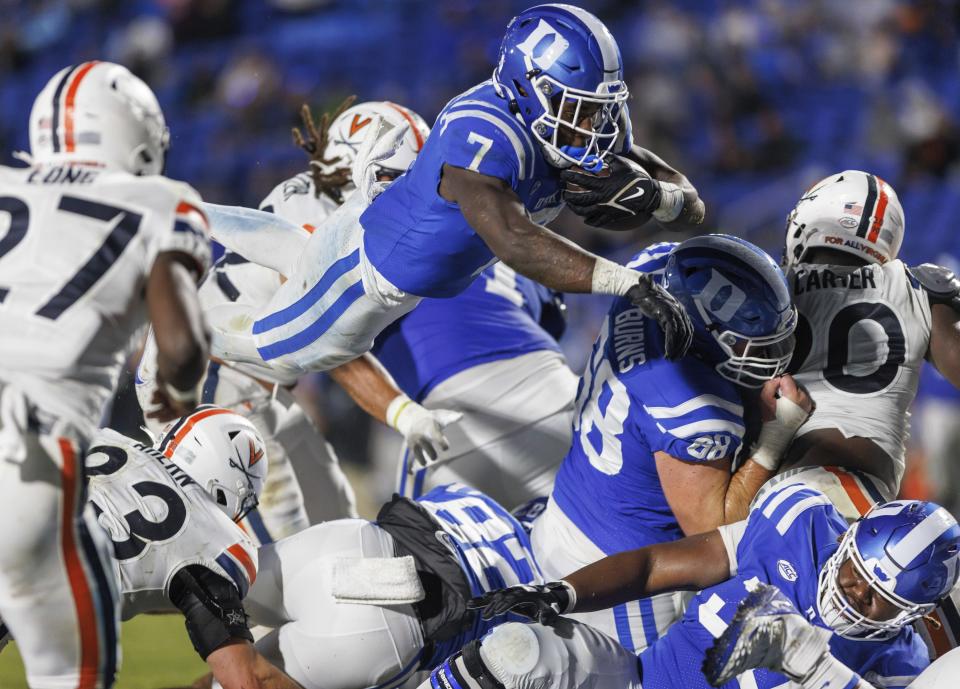 Duke's Jordan Waters (7) leaps for a touchdown during the first half of the team's NCAA college football game against Virginia in Durham, N.C., Saturday, Oct. 1, 2022. (AP Photo/Ben McKeown)